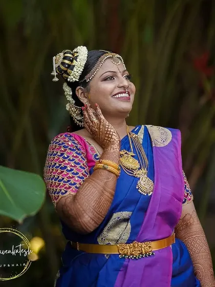 I specialize in authentic Iyengar bridal makeup. This look features the traditional Andal-inspired 'kondai' hairstyle, intricate eye makeup, and radiant skin, creating a divine and timeless appearance for the wedding ceremony.