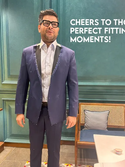 Cheers to those perfect fitting moments! A client trying on his suit during a fitting at our studio, ensuring every detail is just right before the final stitches are made.