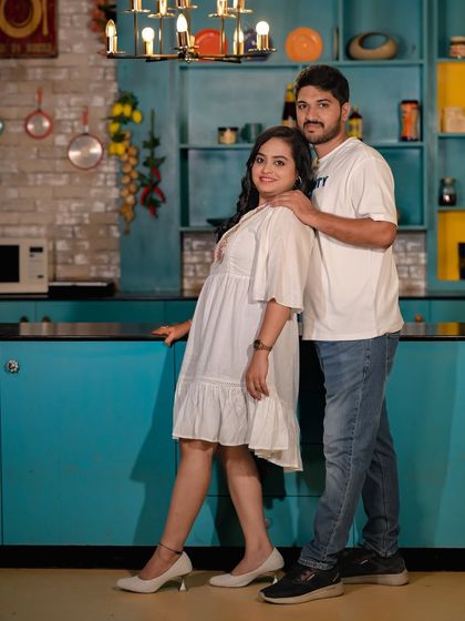 A stylish portrait of a couple in our colorful kitchen set.