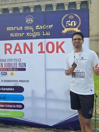 Looking strong after finishing the 10k. This team member is all smiles with his medal.