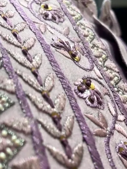 A detailed view of the delicate beadwork and thread embroidery that gives our festive collection its signature look.