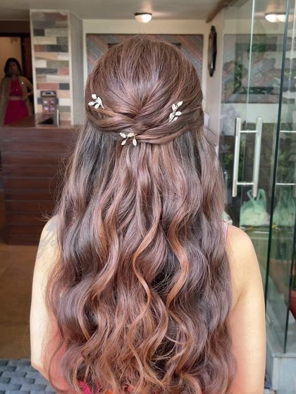 A closer look at the back of the half updo. The simple twists and delicate accessories create a beautiful and effortless look.