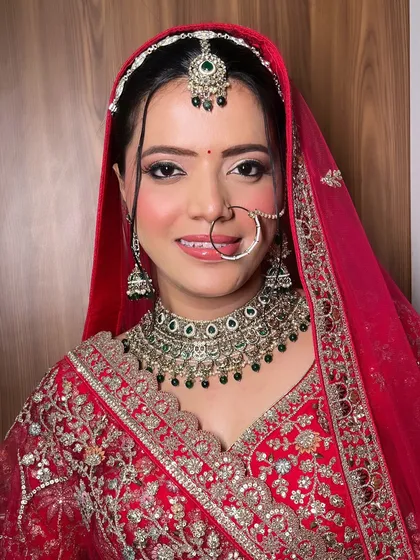 The quintessential Indian bride in a classic red lehenga. For this look, I focused on creating a radiant base, defined eyes, and a timeless elegance that complements the traditional attire perfectly.