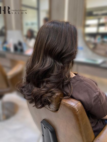 Another angle of the finished global color, styled with soft waves to show off the richness of the shade.