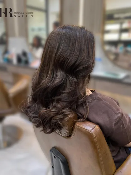 Another angle of the finished global color, styled with soft waves to show off the richness of the shade.