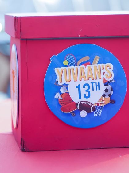 A custom centerpiece box for the 13th birthday sports party.