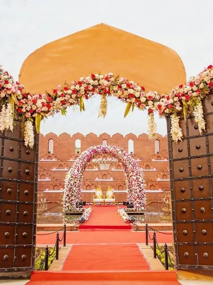 The entrance to your royal wedding should be just as grand. I ensure every detail, from the massive gates to the floral decor, sets the tone for a magnificent celebration from the moment guests arrive.