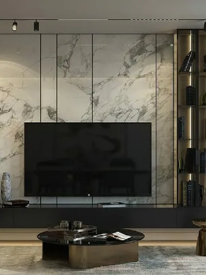 This is an example of a luxury media lounge I created, perfect for a CEO's office or an exclusive client waiting area. The design features floor-to-ceiling marble-style paneling and a custom-built, dark wood media unit. The integrated backlighting in the display shelves adds depth and highlights decorative items.