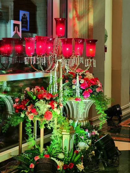 An ornate candelabra with red glass holders, used as a key decorative element for the Sufi Night. The warm red light and crystal details add to the rich, mystical ambiance of the evening.
