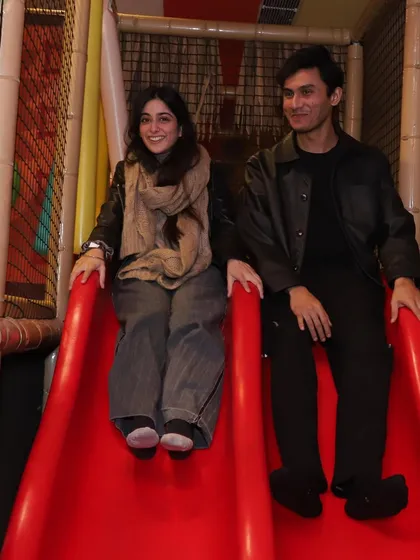 Fun for all ages. Here, our guests are seen enjoying our double slide, proving that you're never too old to play.