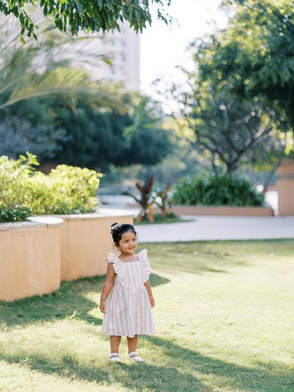 A dreamy mother-daughter session in a sunlit park. The beautiful light and the natural surroundings create a perfect, airy feel for these portraits.