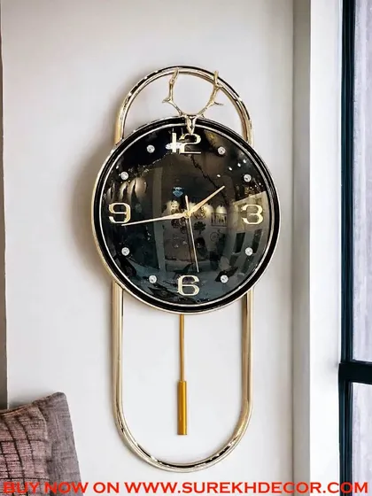 With its deep black face and contrasting gold details, this imported pendulum clock exudes sophistication. The elegant deer-head crest adds a unique design element, making it a perfect statement piece for a refined living space.