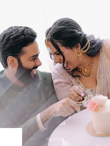 A playful moment during an intimate cake-cutting ceremony, full of laughter and a little bit of frosting.