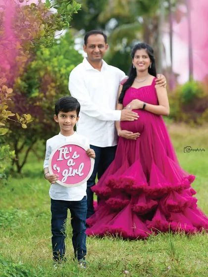 Maternity photoshoots are a wonderful way to celebrate your growing family. We love including older siblings, like in this heartwarming family portrait where big brother announces the arrival of a baby sister.