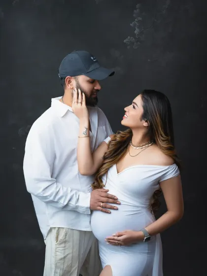 A modern and loving couple's portrait. The way they look at each other speaks volumes, capturing the deep bond between them during this special time.