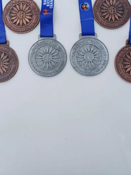A collection of the silver and bronze medals won by our team at the National Kickboxing Championship.