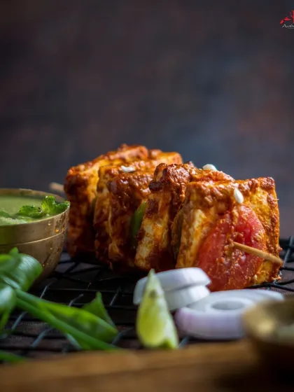 For our vegetarian guests, our Peshawari Paneer Tikka is a true delight. We use the softest paneer, marinated and slow-cooked in the tandoor until it gets that perfect char. It’s a healthy and delicious starter for any occasion.