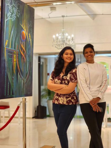 An artist poses with her work 'Intertwined Tale' at her solo exhibition at our gallery. We celebrate these moments where artists can share the inspiration behind their work.