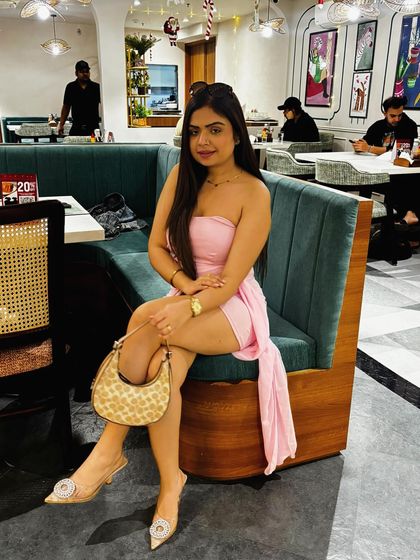 Another shot of the pink party dress, this time in a cafe setting.