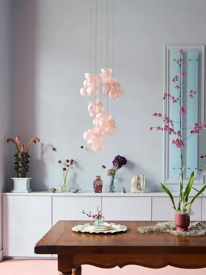 A beautiful composition of the Bocci 100 series in pink, styled as a cascading pendant. This demonstrates how a smaller arrangement can still have a significant artistic impact in a room.