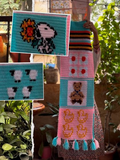 The back view of the custom tapestry muffler, showcasing the variety of designs from Snoopy to sheep and a teddy bear.