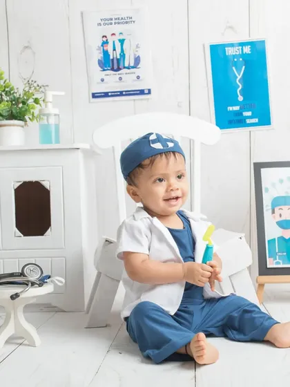 A happy smile from our junior doctor. He's clearly enjoying his role-playing photoshoot.