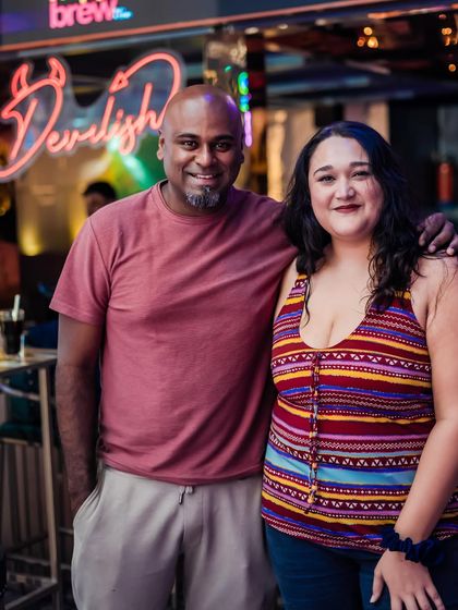 Posing with a guest outside the venue. I enjoy interacting with the crowd both inside and outside the club.