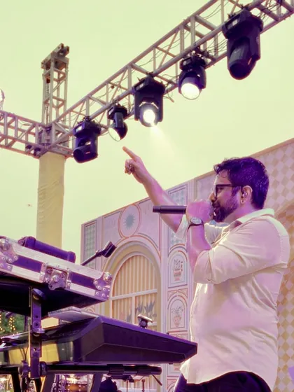 Johaan commanding the stage during an outdoor wedding celebration. We know how to work a crowd and make sure the energy never dips.