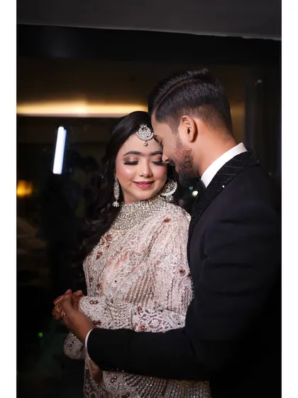 A sweet and romantic close-up of the couple. The bride's soft makeup and glowing skin look beautiful from every angle.