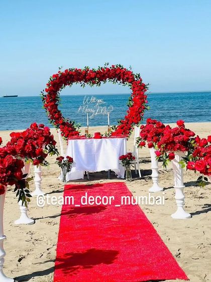 A beautiful, clear shot of the entire beach marriage proposal setup, a truly picture-perfect moment.