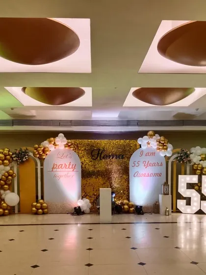 A full shot of the 55th birthday decor, highlighting the scale of the setup. The arrangement includes multiple elements like the shimmer wall, marquee numbers, and custom panels to create a cohesive and impressive look.