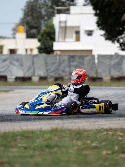 A lone driver on the track during a practice session, perfecting his lines and pushing for faster lap times.