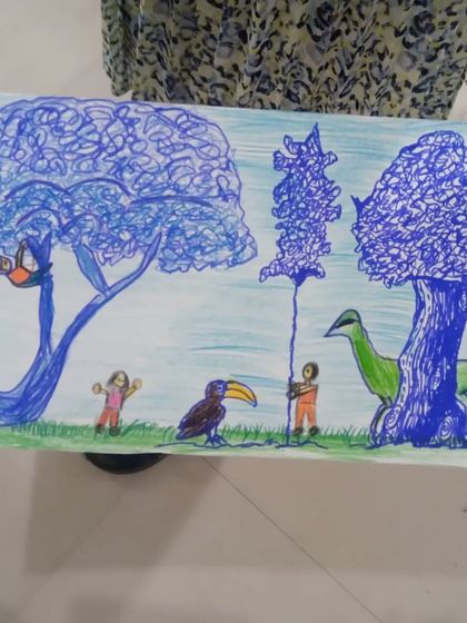 A close-up of a jungle scene created by Biya, a 7th standard student. She used sketch pens to create intricate, scribbled textures for the trees and unique characters.