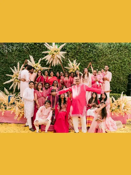 A Haldi is incomplete without a massive group photo with your entire tribe. This picture is a beautiful, chaotic memory of all the people who showered us with love and, of course, a lot of haldi.