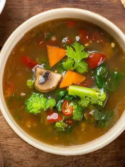 A hearty bowl of Chinese vegetable soup. The overhead shot captures the variety of fresh ingredients in the broth.