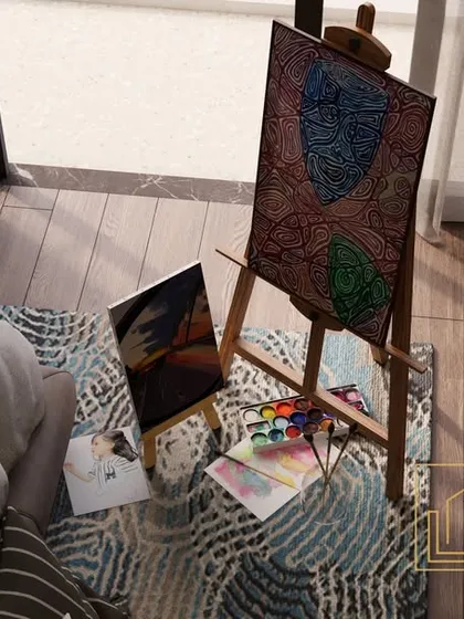 A close-up of the art corner, showing how personal items can be integrated into the room's design. The natural light from the window makes it an ideal spot for creative pursuits.