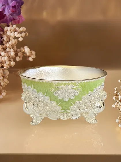 Festive tables deserve a centerpiece as special as this. My enamel bowl, adorned with graceful peacocks in a refreshing lime green, makes a timeless and vibrant gift.