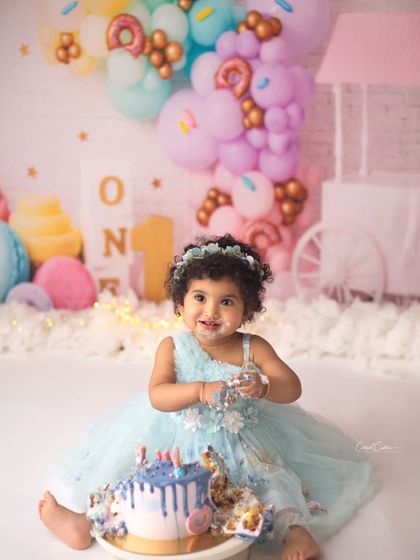 This little darling is celebrating one with the sweetest, most beautiful smile. Her donut-themed party was full of color, joy, and of course, lots of yummy cake.