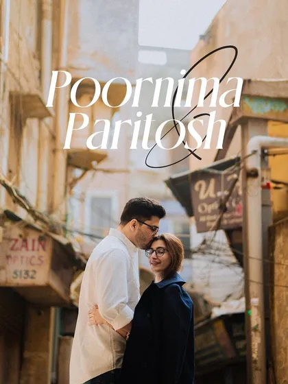 An intimate pre-wedding portrait in the narrow lanes of Old Delhi, with the groom kissing his fiancée's forehead. We find romance in the most unique urban settings.