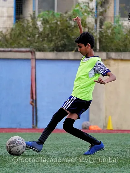 A player practices his shooting form, focusing on technique to generate power and accuracy.