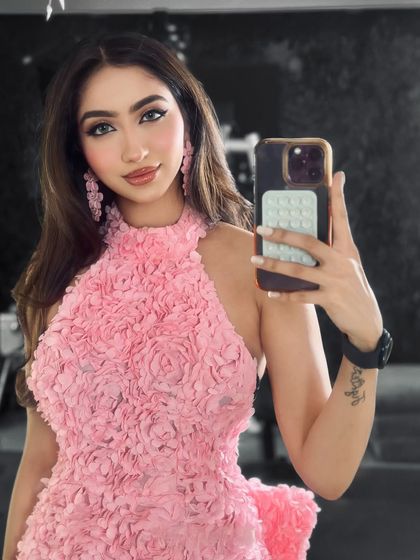 A selfie showing off this beautiful Arabian glam look. The focus is on the sharp, winged eyeliner and soft pink tones.