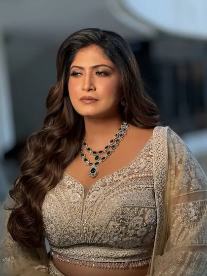 This shot captures the bride's confident and glamorous look. The makeup is polished and perfect for an evening event.