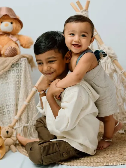 Capturing the beginning of a lifelong friendship between siblings is one of my greatest joys. This tender hug between an older brother and his new baby brother is a perfect example of the sweet stories I love to tell.