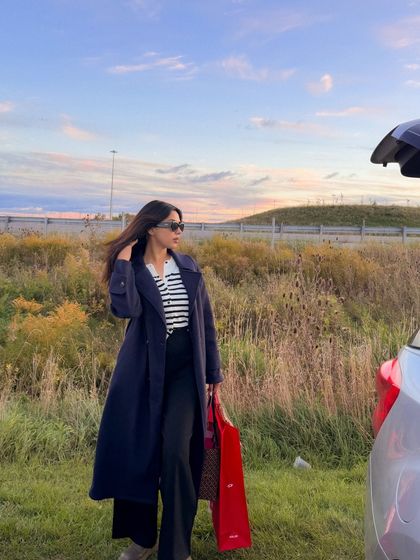 A shot of my fall shopping outfit against a beautiful sunset sky.