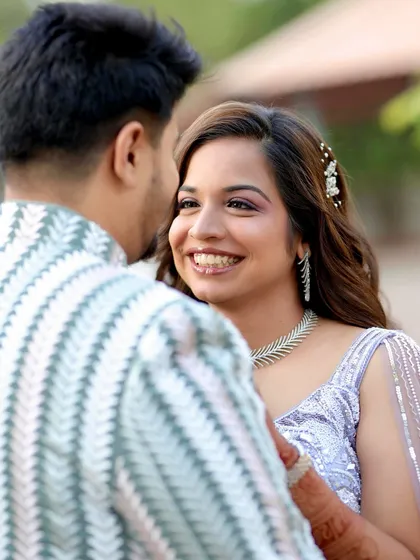Capturing the pure joy of an engagement day. This candid moment shows how the right makeup enhances your happiness. Her radiant smile is highlighted by a soft glam look with a pop of color on the eyes, ensuring she looked and felt her best.