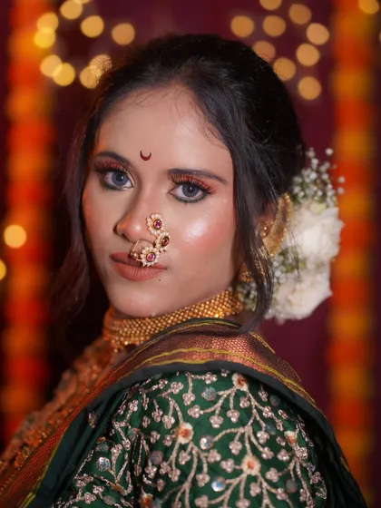 A closer look at the radiant makeup for this Nauvari bride. The glowing skin, combined with a bold eye and traditional jewelry, creates a look that is both regal and timeless.