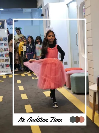 This participant is all grace in her pink dress, practicing her walk for the judges.