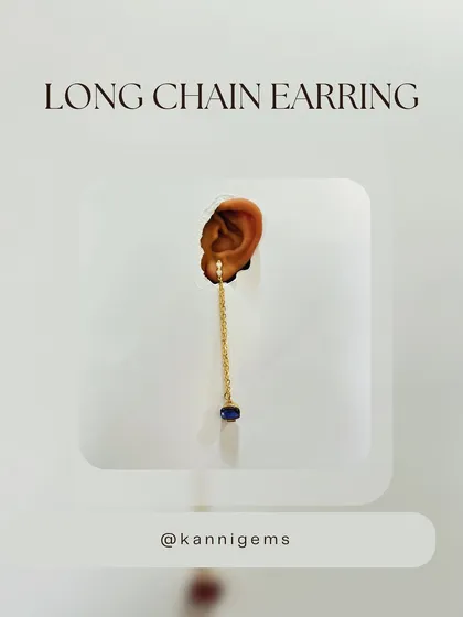 The same long-chain earring, this time with a detachable deep blue stone. This feature allows you to customize your look, proving that every day deserves a little drama.