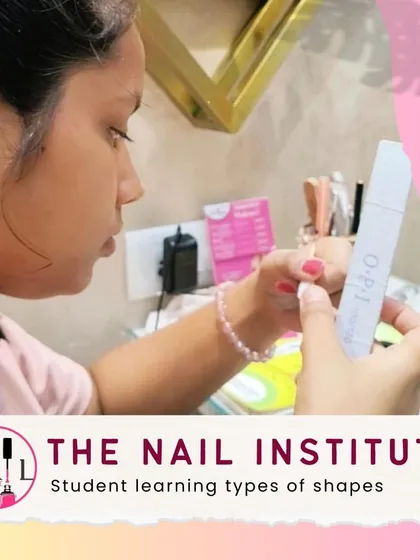 Using a professional OPI file, this student is learning how to create various nail shapes, the foundation of any great manicure.