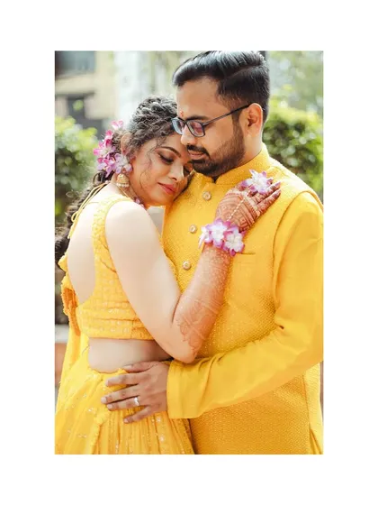 A tender embrace during Mithila and Sagar's Haldi ceremony. The vibrant yellow of their outfits and the genuine emotion make this a standout shot from their "phoolo ki haldi".